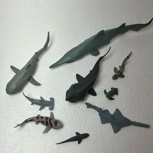 Lot of 8  shark figurines with a seal